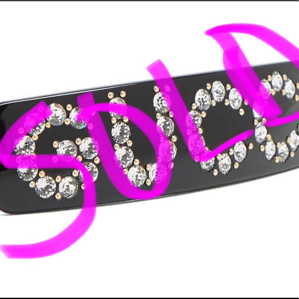 Black Gucci rhinestone hair clip